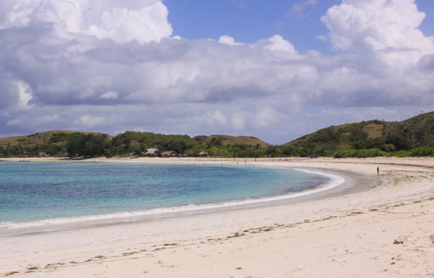 istock Crystal clear water white sand Kuta beach Lombok 1219314676
