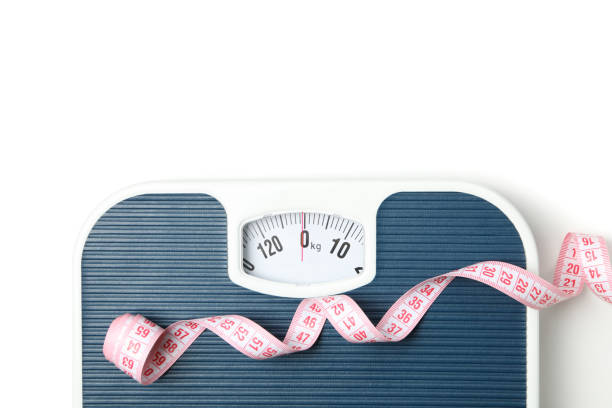 istock Scales and measuring tape isolated on white background 1219315390