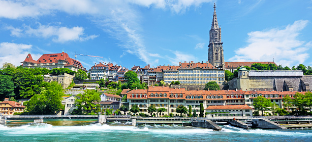 Panoramic view of Bern cityscape on a sunny summer day, Switzerland. Composite photo