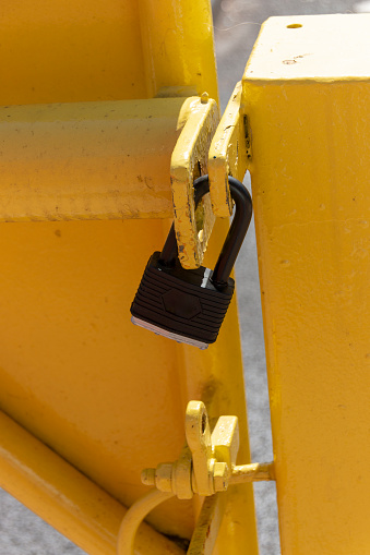 a close up view of a yellow metal boom that has been locked