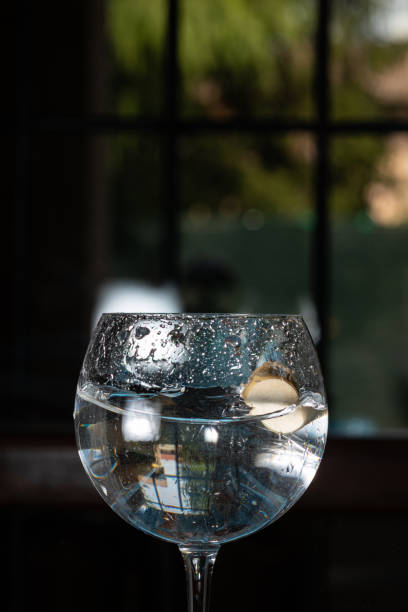 istock Cap thrown into a glass of water 1219317060