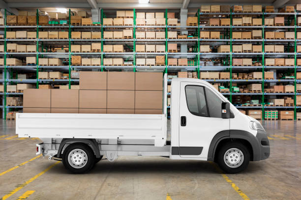 istock Pickup truck loaded with parcels in large warehouse 1219317362
