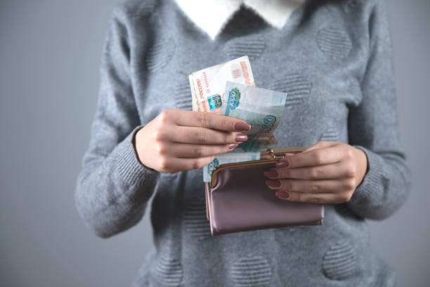 istock woman hand money with wallet 1219326559