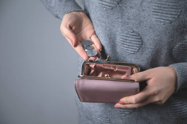 istock woman hand coin with wallet 1219326569
