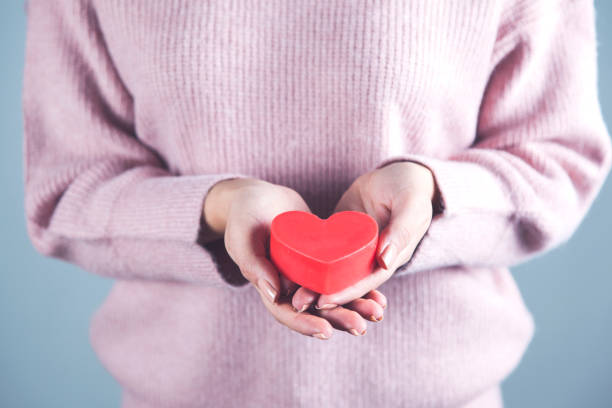 istock woman holding heart 1219326702