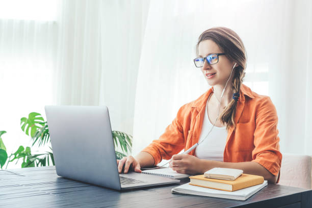 istock Woman sits in front of lap top. 1219326794