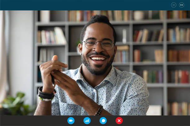 istock Headshot portrait biracial man talk on webcam at home 1219329114