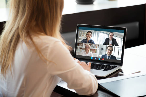 istock Female employee have team web conference on laptop 1219329123