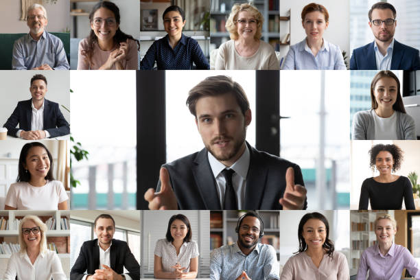 istock Screen view of smiling employees have online webcam conference 1219329139