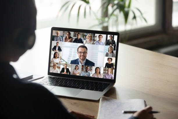 istock Female employee have team web conference on laptop 1219329152