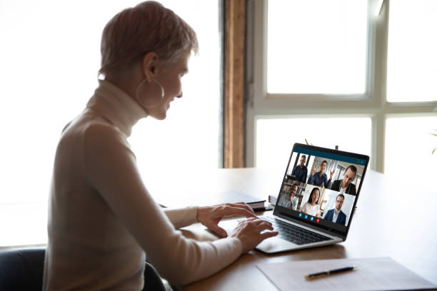 istock Female employee have webcam conference with diverse coworkers 1219329163
