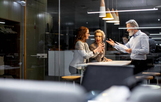 istock Business people working late in the office 1219332894
