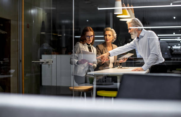 istock Business people working late in the office 1219332956