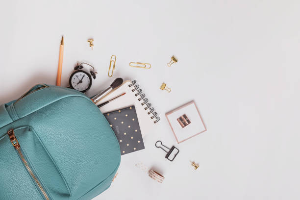 istock Student's backpack with different stationery and study supplies on the white background 1219333108