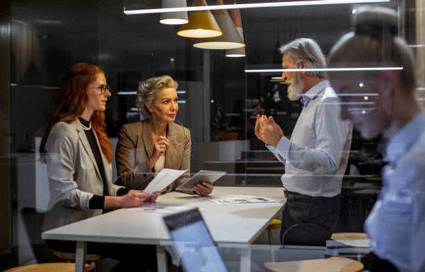 istock Business people working late in the office 1219333305