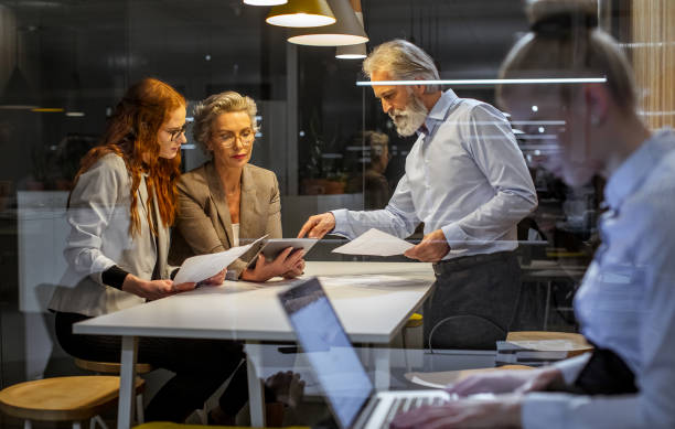istock Business people working late in the office 1219333563