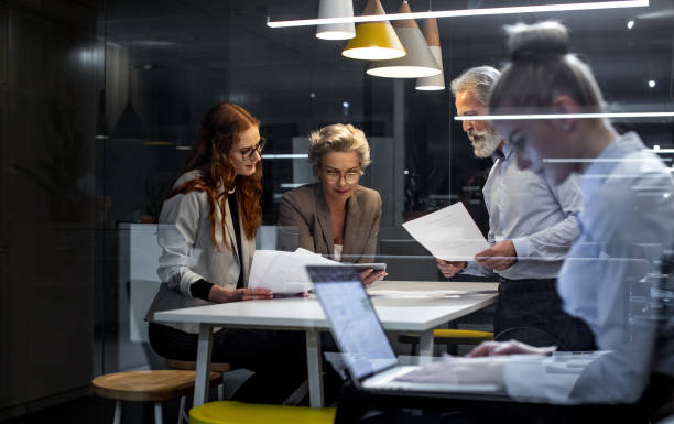 istock Business people working late in the office 1219333564