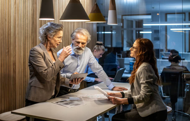 istock Business people working late in the office 1219334029