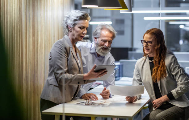 istock Business people working late in the office 1219335067