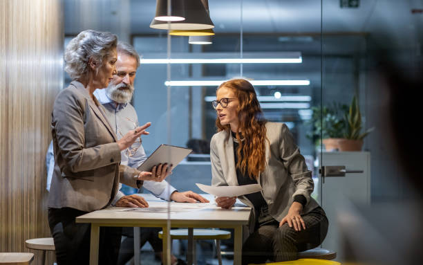istock Business people working late in the office 1219335223