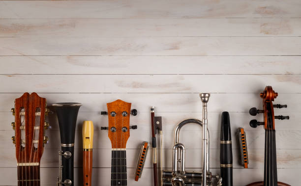 instruments in white wooden background musical instruments in white wooden background musical instrument stock pictures, royalty-free photos & images