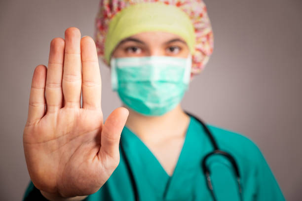 istock doctor showing stop sign with her hand 1219335982