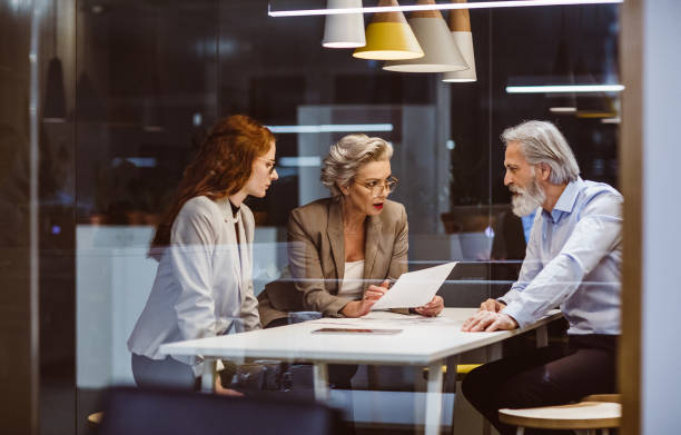 istock Business people working late in the office 1219337450