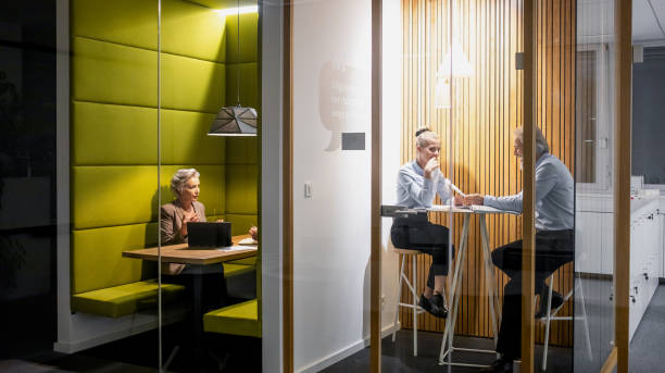 istock Business people discussing in a modern business longue 1219338534