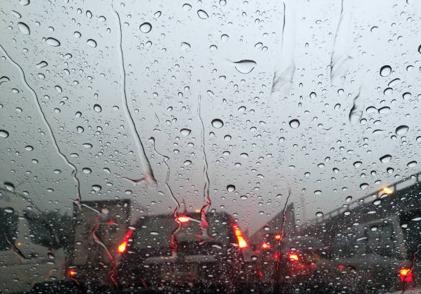 istock Raindrops On Car Glass Window During Rainy Season 1219340209