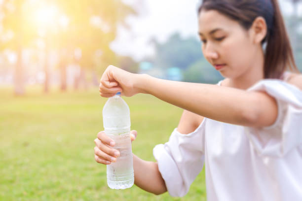 istock the women open bottle 1219344012