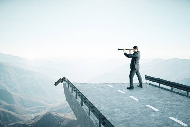 istock Businessman with telescope 1219346616