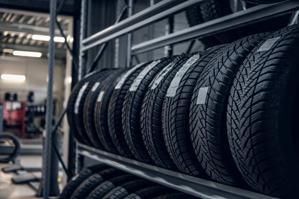 istock Variety of tyres at busy warehouse 1219346685