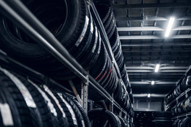 Variety of tyres at busy warehouse stock photo