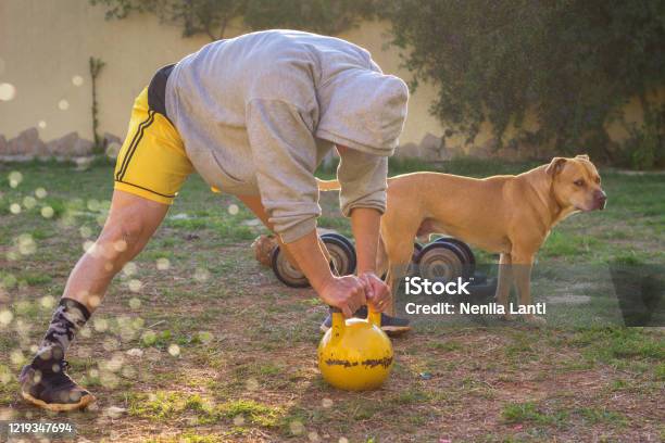 Man Workout In House Yard At Sunset Stock Photo - Download Image Now - Activity, Adult, Adults Only