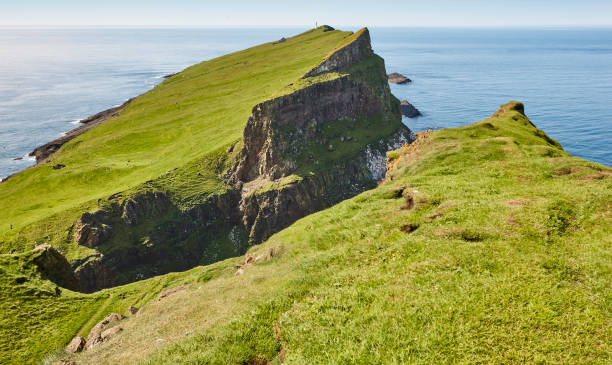 istock Mykines lighthouse and cliffs on Faroe islands. Hiking highlight 1219347927