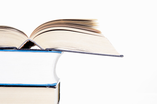 Stack of books on white background