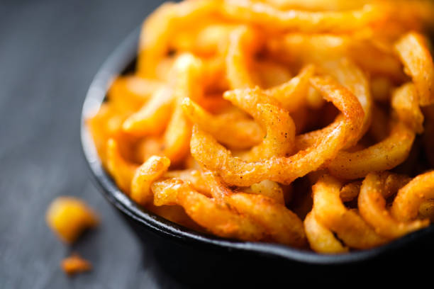 istock rustic golden crispy curly fries 1219348838