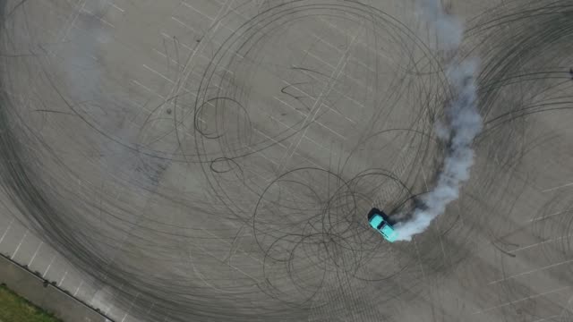 Aerial View Of Driver Training Drifting On Sports Car.