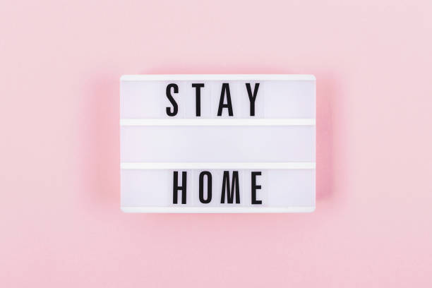 istock Flatlay with a lamp and words stay at home. 1219350130