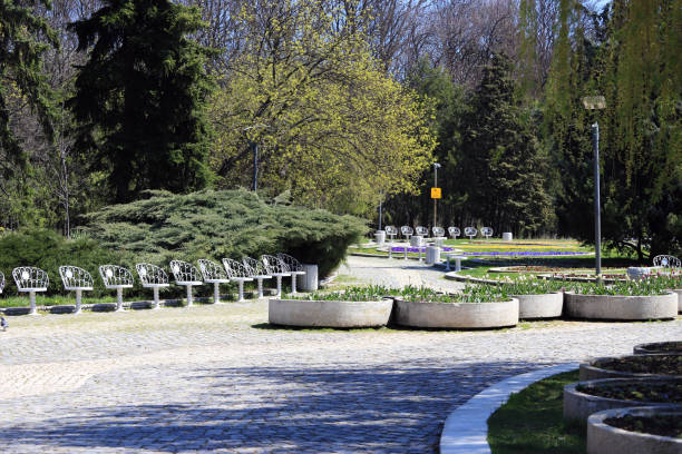 istock Empty park with empty benches as prevention from coronavirus Covid-19 disease 1219350583
