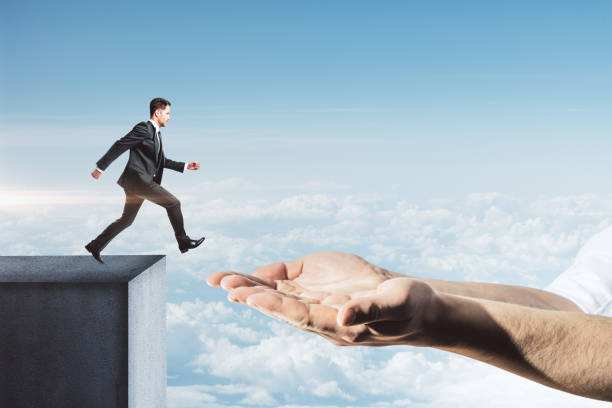 istock Young businessman in suit jumping 1219351601