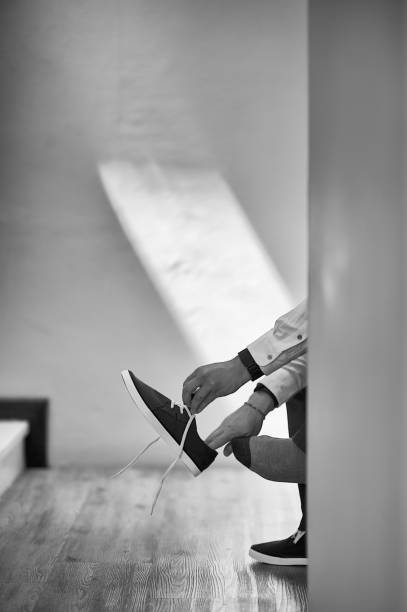 istock Black and White Dressing Up Funky Businessman with sneakers 1219352389