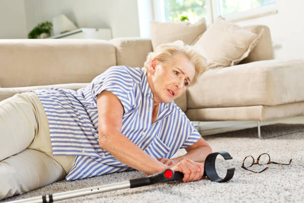 istock Senior woman lying on the floor after falling down 1219353925