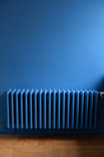 istock Blue Walls and radiator Close 1219355212