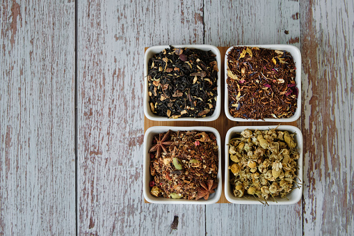 Detail of tea, herbal and rooibos dry leaves. Detox and healthy infusion. Top view with copy space. Flat lay