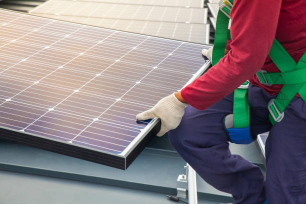 istock Technician installing solar panels, Renewable energy clean and good environment. 1219355691