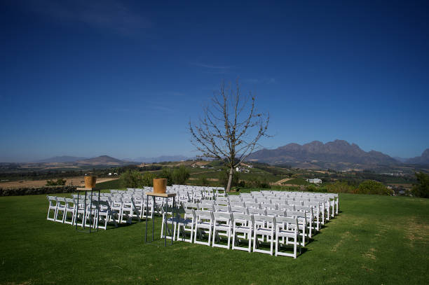 istock Outdoor Wedding Ceremony Setting on Lawn with mountain view 1219356895