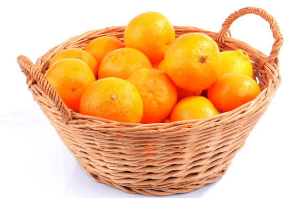 istock Tangerine basket on white background 1219358348