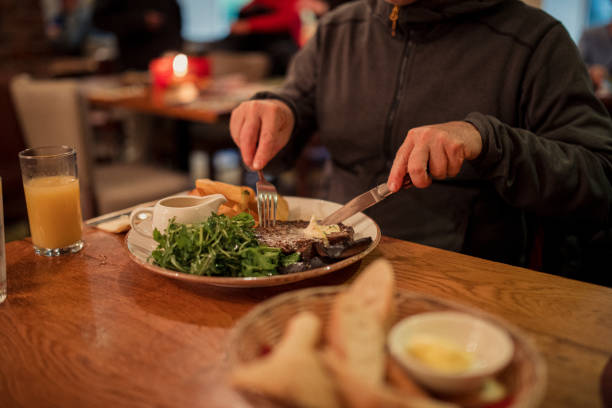 istock Unrecognisable Man Having Steak At A Restaurant In The Evening 1219358686