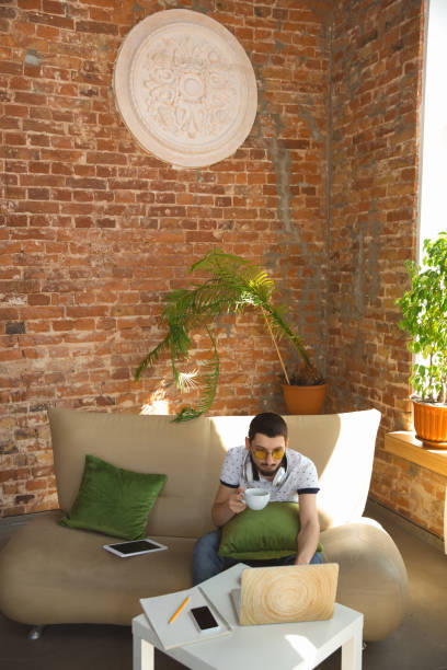 istock Man working from home during coronavirus or COVID-19 quarantine, remote office concept 1219360192